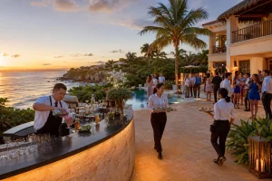 Riviera Maya Catering with bartenders and service staff preparing cocktails and passed food for a private oceanfront event