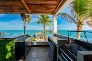 Outdoor grill and preparation area at a beachfront Riviera Maya villa overlooking the Caribbean Sea