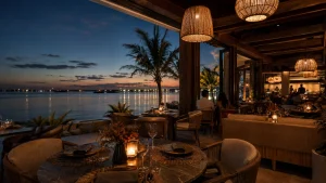 Waterfront restaurant in Cancun with candlelit tables overlooking the ocean at night