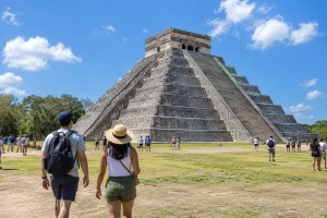 Travellers visiting Chichen Itza on a day trip from Cancun during a short vacation