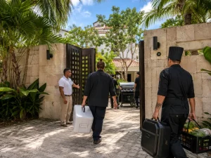 Private villa grill service Playa del Carmen with chefs arriving with catering equipment, ingredients and portable BBQ setup