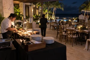 Guests enjoying a relaxed after-party dinner by the sea in Riviera Maya