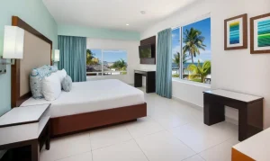 Cancun resort hotel room for travelers comparing an all-inclusive stay with a private villa