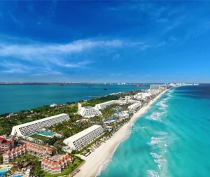 Cancun villa vs all inclusive comparison showing a large beachfront resort in Cancun
